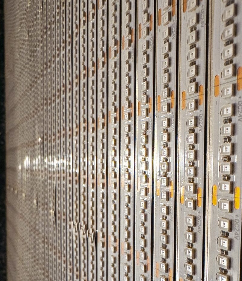 Close-up of rows of TRUE-365 24V 365nm UV LED strips, 240 LEDs per meter, laid side by side in an exposure unit
