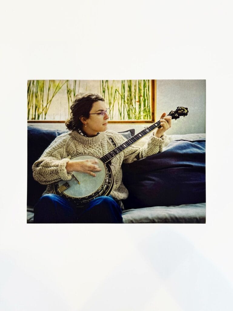 Four-plate CMYK color photogravure of a banjo player by Mort O’Sullivan