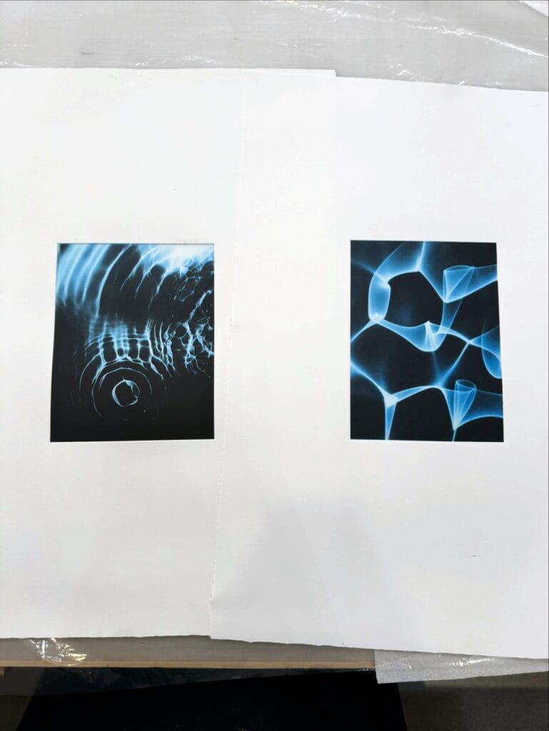 Two blue duotone photogravures by Paula Pink