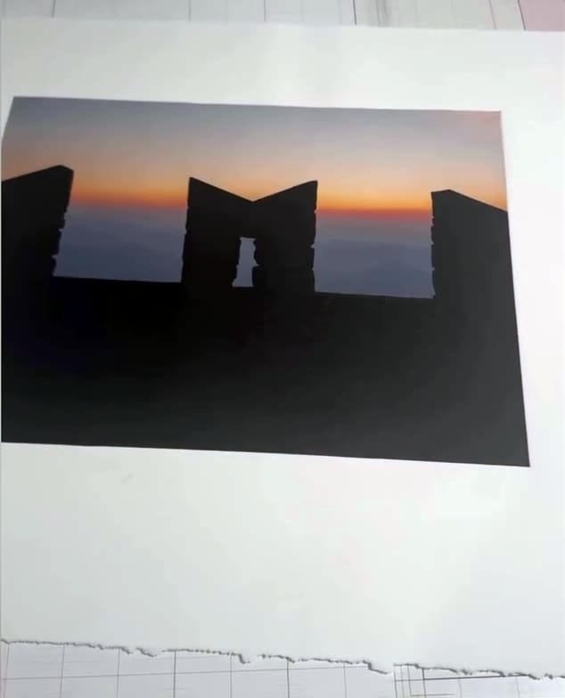 Color photogravure of a silhouetted ruin against a sunset sky, printed at a Prints on Paper Studio workshop