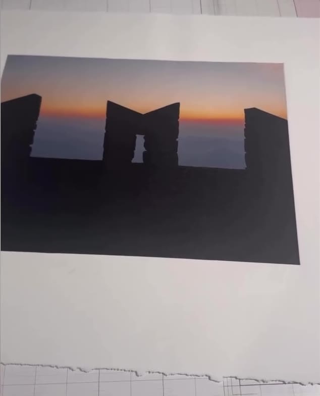Color photogravure of a silhouetted ruin against a sunset sky, printed at a Prints on Paper Studio workshop